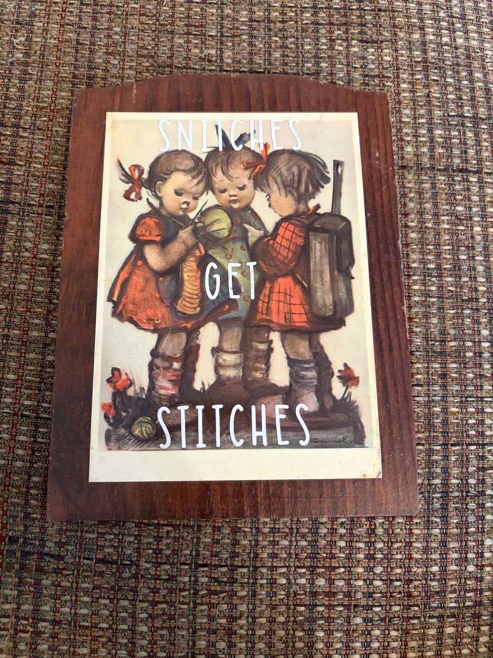 Vintage-style Wooden Plaque "Stitches Get Stitches" with Children Illustration